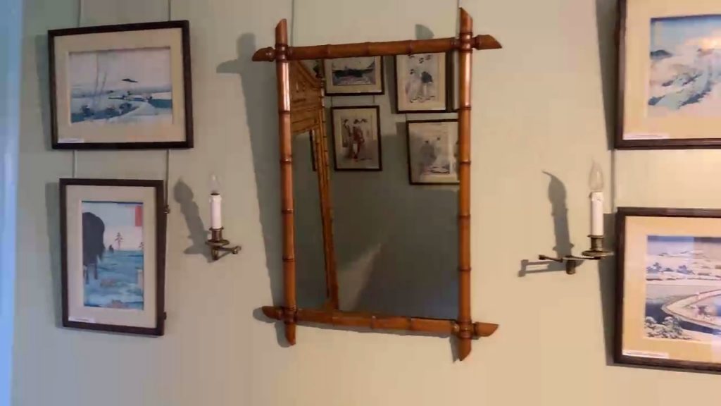 a mirror with a bamboo frame