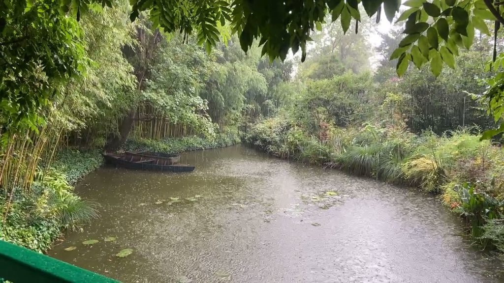 Claude Monet's water lily pond with a rowboat