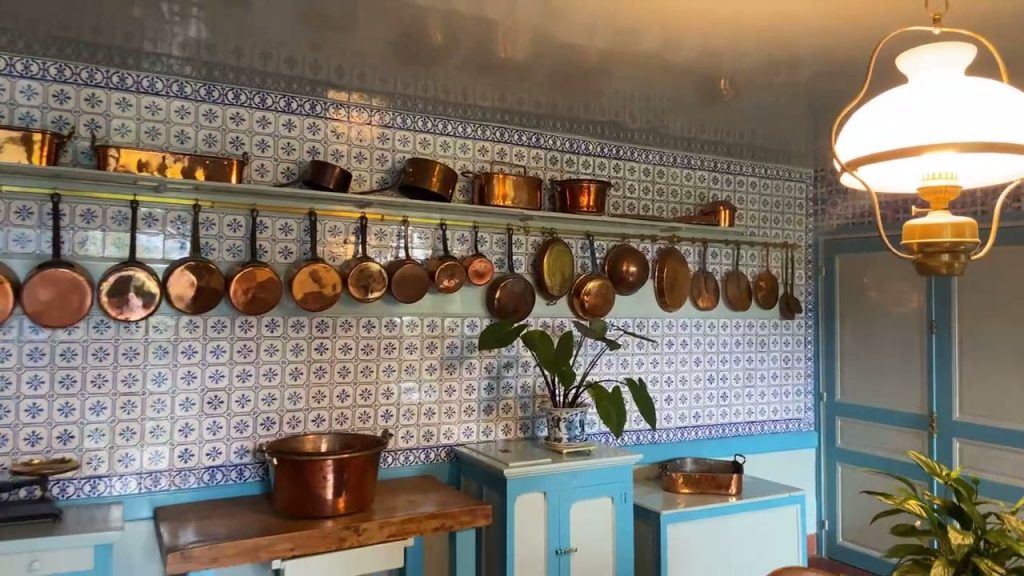 copper pans hanging in Claude Monet's kitchen